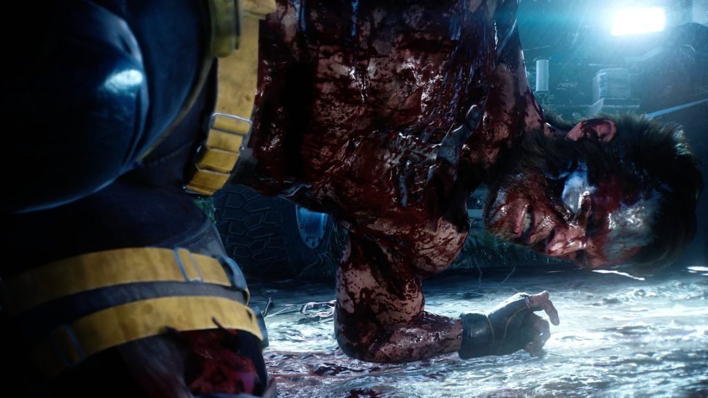 Wolverine on the ground bloodied and his adamantium skeleton showing from a brutal fight in Marvel’s Wolverine.